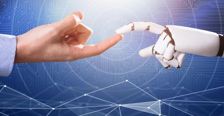 human finger touches robot finger