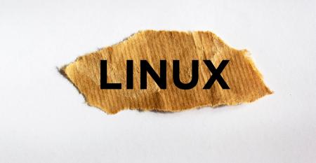 Linux text on brown torn paper