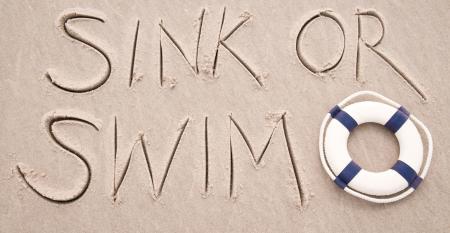 "sink or swim" written in the sand