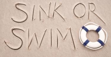 "sink or swim" written in the sand