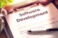 "software development" written on a clipboard